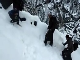 Watch: Polling Officials In Himachal Walk 15km On Snow For 6 Hours Watch: Polling Officials In Himachal Walk 15km On Snow For 6 Hours