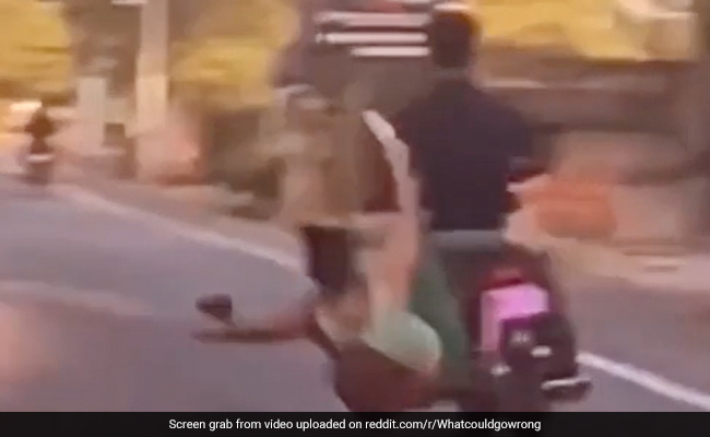 Viral Video: Woman Falls While Trying to Kick Bike Rider, Internet Says "Instant Karma"