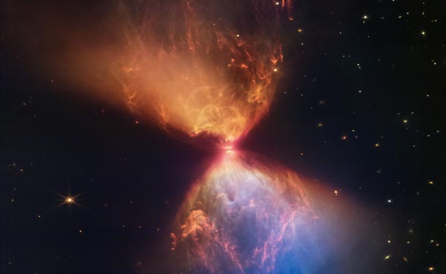 Blazing "Hourglass" Around Young Star Captured By NASA's Telescope