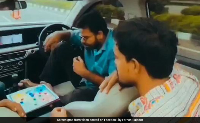 Watch: Man Uses Driver Assist Feature To Play Cards In Moving SUV, Internet Shocked
