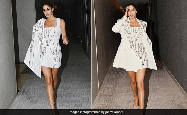 Janhvi Kapoor Struts Into The Holiday Season In A Glitzy White Mini Dress And Matching Trench Coat
