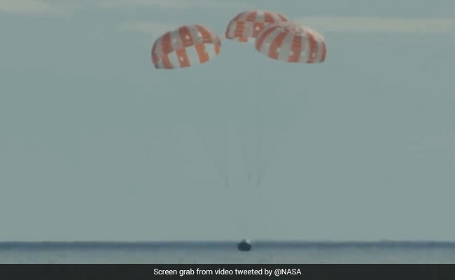 NASA's Orion Capsule Splashes Down In Pacific After Historic Moon Mission