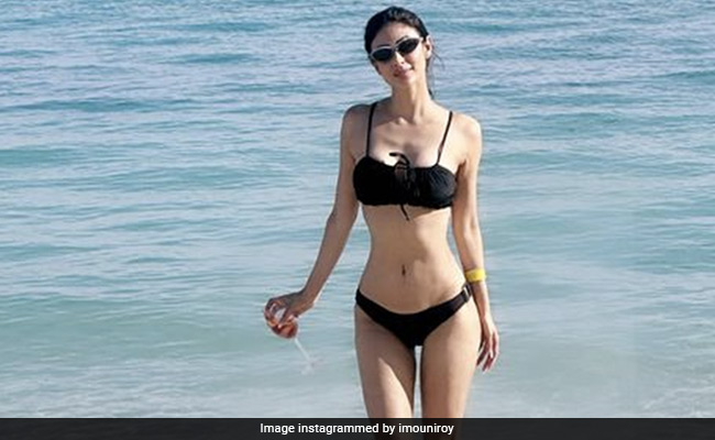 To End 2022 In Style, Mouni Roy Sports A Chic Black Swimsuit On A Sunny Day At The Beach