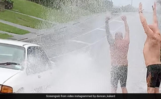 Video Of Men Waiting For Cars To Splash Water On Them Goes Viral