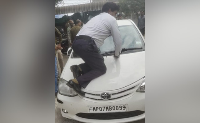 Watch: Asked To Pay Challan, Driver Dangerously Drags Traffic Cop On Car Bonnet For 4 Km