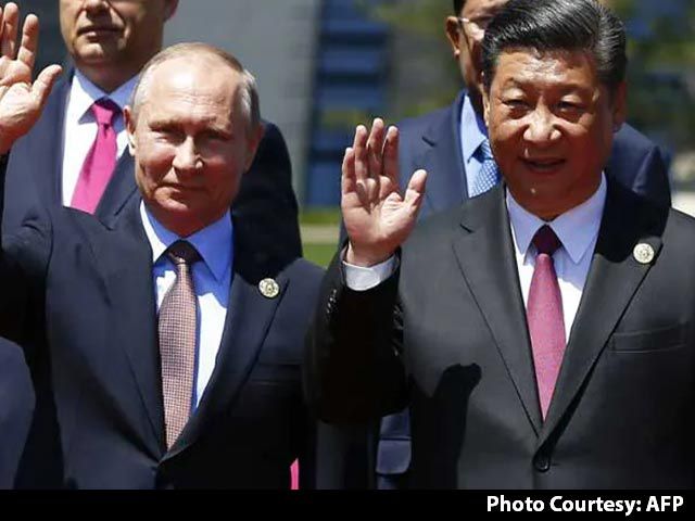 Russia's Putin Expects China's Xi To Visit Moscow, Xi Holds His Line On Ukraine