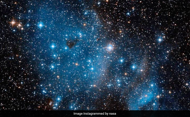 NASA's Hubble Space Telescope Captures Open Star Cluster Glittering In A Nearby Galaxy