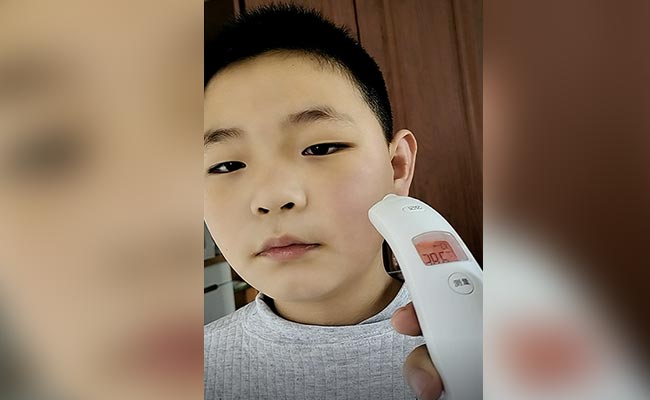 Video: Thermometer Shows Different Readings On Covid+ Boy's Cheek In China