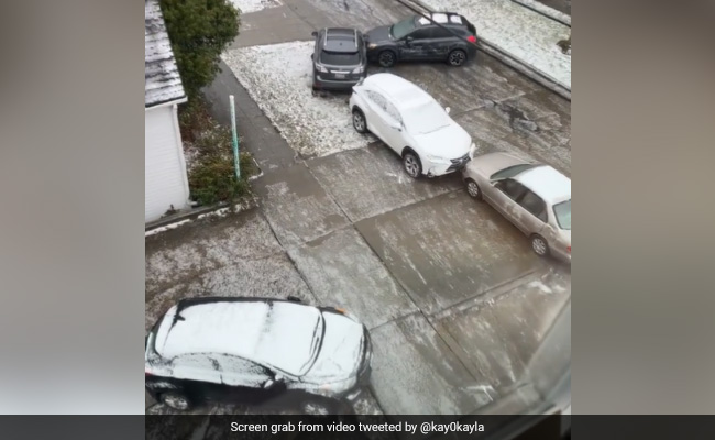 On Camera, Car Collides With Multiple Vehicles After Sliding Down Icy Street In US