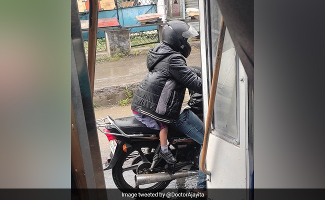 Viral Photo Of A Father Shielding His Child From The Rain Will Melt Your Heart
