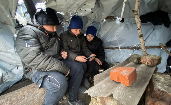 Windswept Hill With Mobile Signal Serves As Classroom For Ukrainian Kids