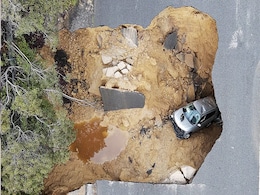 Video: Sinkhole Swallows 2 Cars In Los Angeles In Massive Storm Video: Sinkhole Swallows 2 Cars In Los Angeles In Massive Storm