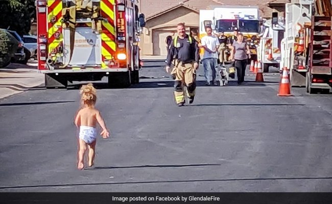 Toddler Runs To Her Firefighter Dad To Give Him A Hug After He Fixes Leak In Locality