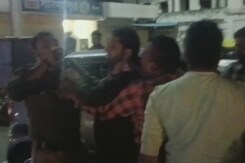 Madhya Pradesh BJP MLA's Supporters Rush Out Of Car, Surround Cop And Thrash Him Madhya Pradesh BJP MLA's Supporters Rush Out Of Car, Surround Cop And Thrash Him