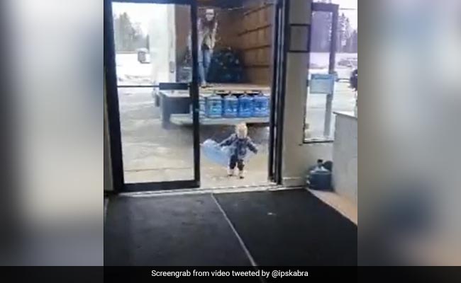 Wholesome Video Shows Toddler Helping Mother Unload Water Jars From Truck