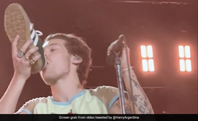 Viral: Harry Styles Drinks Out Of Shoe At Perth Concert - It's An Oz Tradition