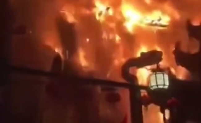Watch: Dramatic Footage Shows Temple Roof Collapsing As Huge Fire Erupts In China
