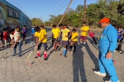 Hockey Coach Negi Training Budding Players On Footpath In Indore Hockey Coach Negi Training Budding Players On Footpath In Indore