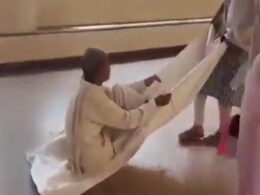 Video: No Hospital Stretcher, Elderly Man With Broken Leg Dragged On Cloth In Gwalior Hospital Video: No Hospital Stretcher, Elderly Man With Broken Leg Dragged On Cloth In Gwalior Hospital