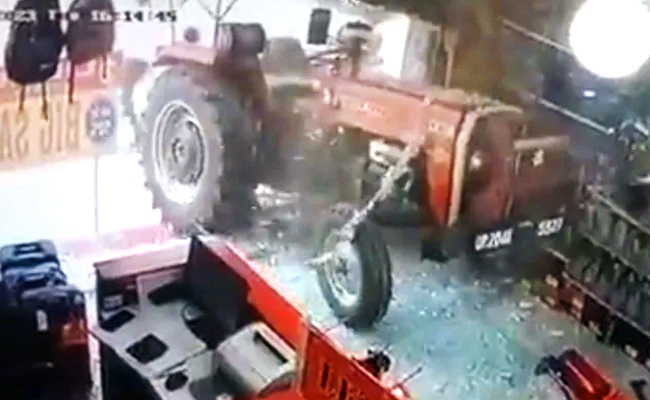 Viral Video Shows Tractor Starting On Its Own And Breaking Glass Doors Of A UP Shop