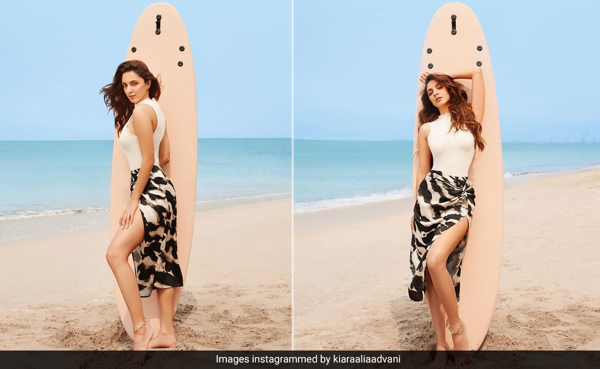 Looks Like The Surf's High Enough For Kiara Advani In A White Swimsuit And Printed Sarong To Say "Beach Please"
