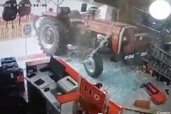Viral Video Shows Tractor Starting On Its Own And Breaking Glass Doors Of A UP Shop Viral Video Shows Tractor Starting On Its Own And Breaking Glass Doors Of A UP Shop