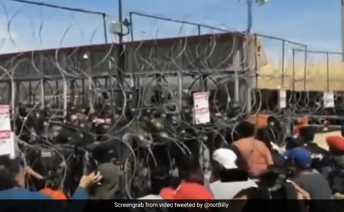 Video Shows Hundreds Of Migrants Trying To Force Their Way Into US At Mexico Border