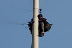 Watch: Paragliding Gone Wrong, Two People Stuck On An Electric Pole In Kerala Watch: Paragliding Gone Wrong, Two People Stuck On An Electric Pole In Kerala