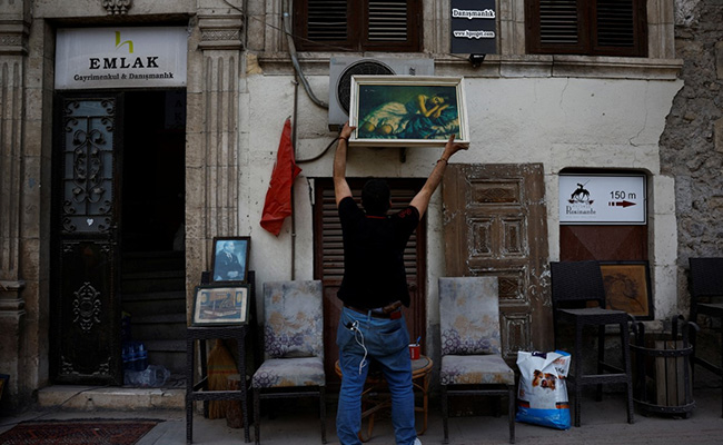 "Happy Here": Turkish Antique Seller Stays Put In Earthquake Aftermath