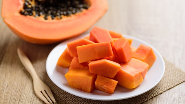Avoid consuming large amounts of papaya at once, as this can increase the risk of digestive discomfort