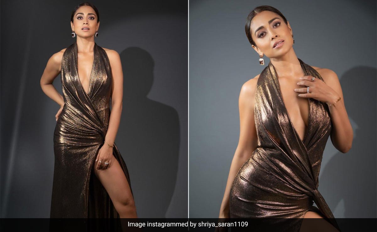 On Her Metallic Gown, Shriya Saran's Plunging Neckline And Thigh High Slit Are Both Competing For Attention