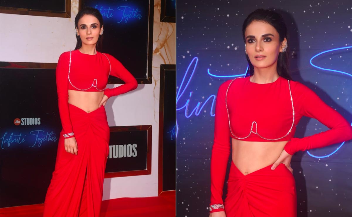 Radhika Madan Stands On The Cutting Edge Of Fashion In A Red Ruched Skirt And Crop Top With Diamonte Underwire