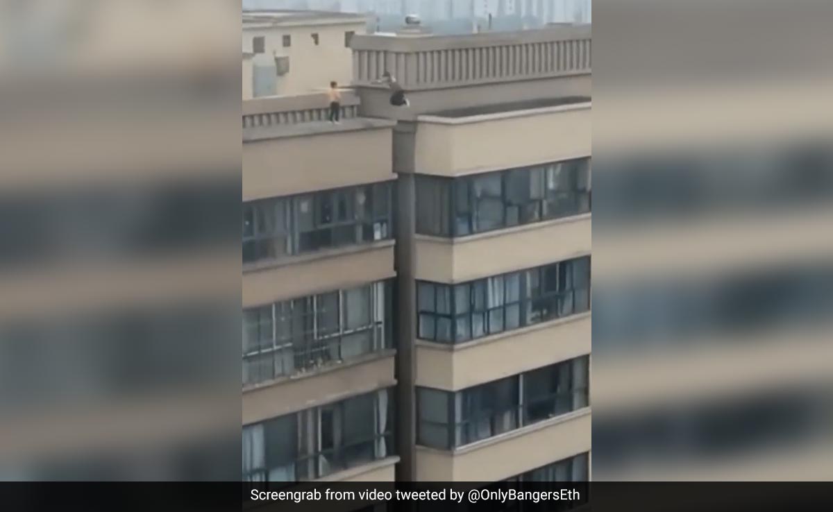 Old Video Captures Heart-Stopping Moment When Boy Leaps Across Gap Between 27-Storey Buildings In China