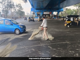 Pic Of Mumbai Cop Covering Slippery Road With Sand Earns Praises Online Pic Of Mumbai Cop Covering Slippery Road With Sand Earns Praises Online