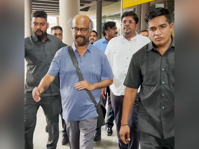 Rajinikanth Greets The Paparazzi At The Airport