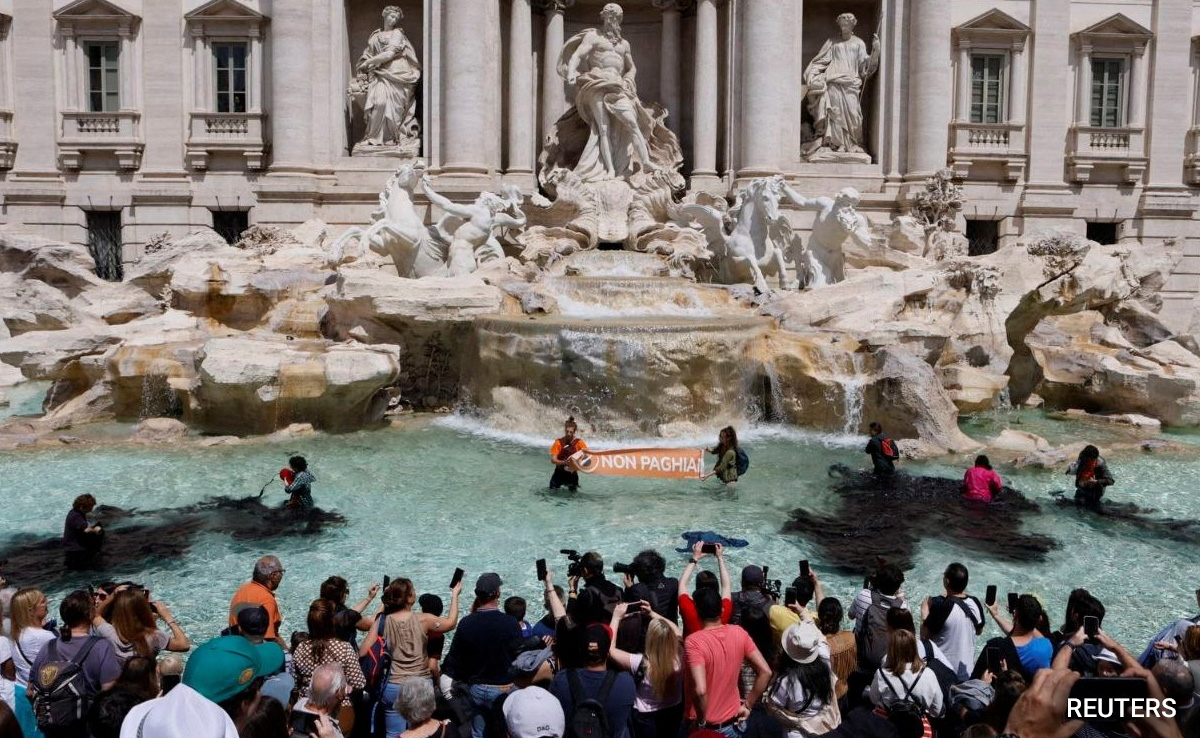 Rome's Iconic Trevi Fountain Water Turns Black In Climate Protest