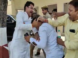 Watch: Samajwadi MLA Thrashes BJP Leader's Husband In Police Station Watch: Samajwadi MLA Thrashes BJP Leader's Husband In Police Station
