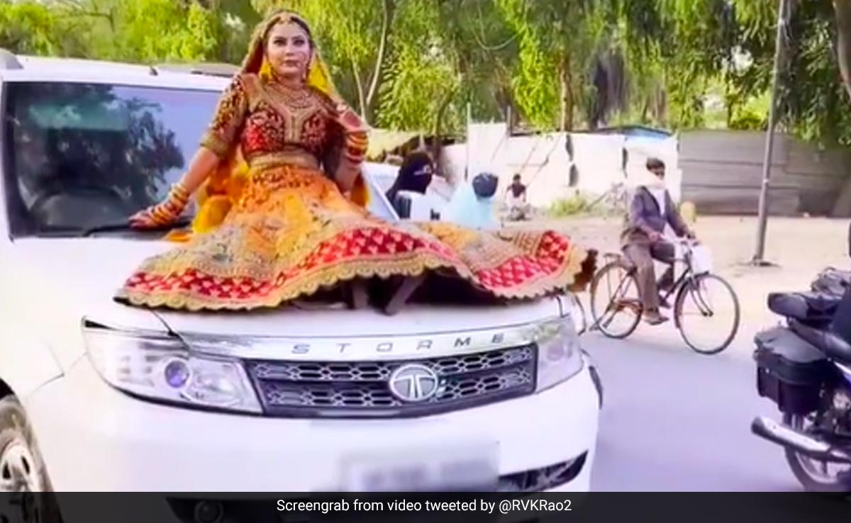 UP Woman In Bridal Attire Shoots Video On Moving Car's Bonnet, Fined