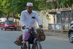 Dabbawala Collects Clothes While Distributing Lunchboxes Dabbawala Collects Clothes While Distributing Lunchboxes