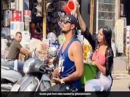 Man And Woman Take Bath On A Scooter In Maharashtra, Police Take Note Man And Woman Take Bath On A Scooter In Maharashtra, Police Take Note