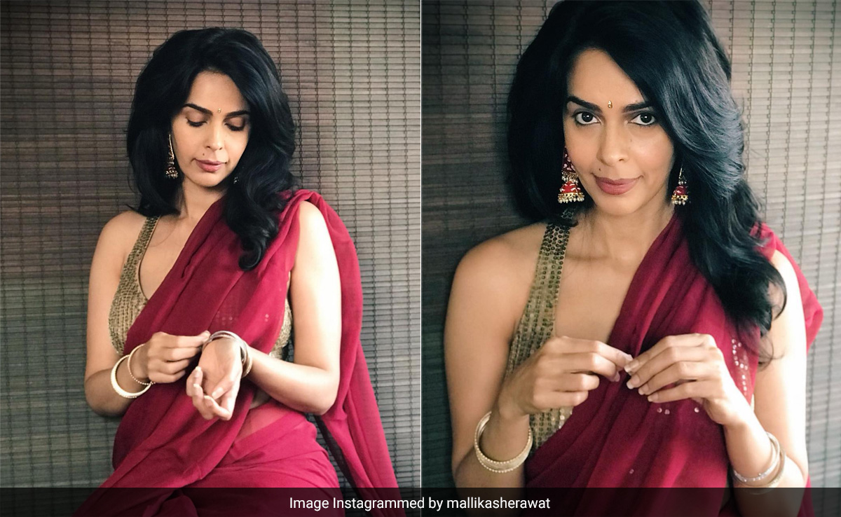 In A Red And Gold Number, Mallika Sherawat Confesses To Being A "<i>Saree</i> Girl", And A Chic One At That