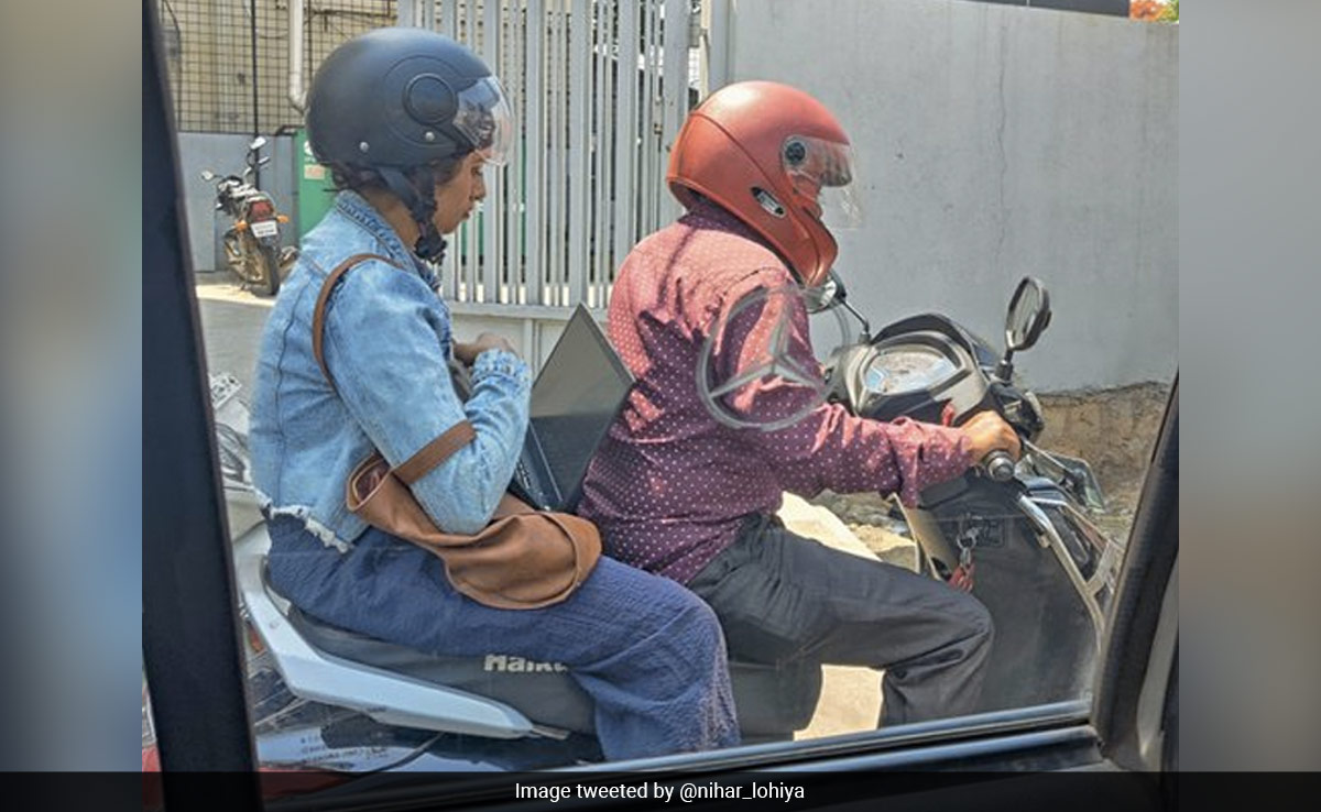 Bengaluru Woman Works On Laptop While Riding Pillion, Sparks Debate On Work Culture