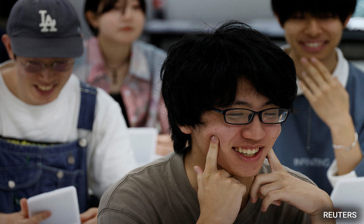 Japanese Get Trained In "Hollywood Smiles" As Masks Slowly Come Off