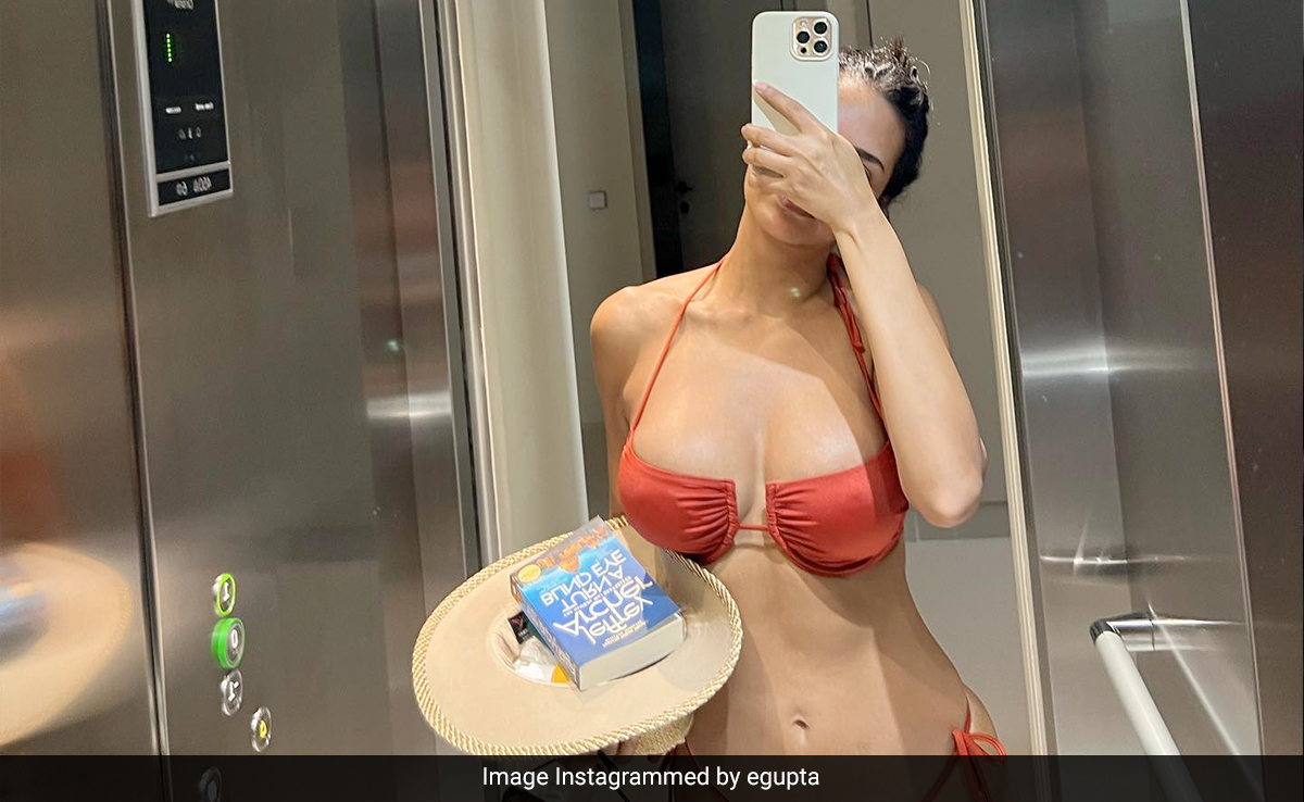 Esha Gupta's Summer Days Are Spent In Orange Swimwear With A Straw Hat And Sunglasses