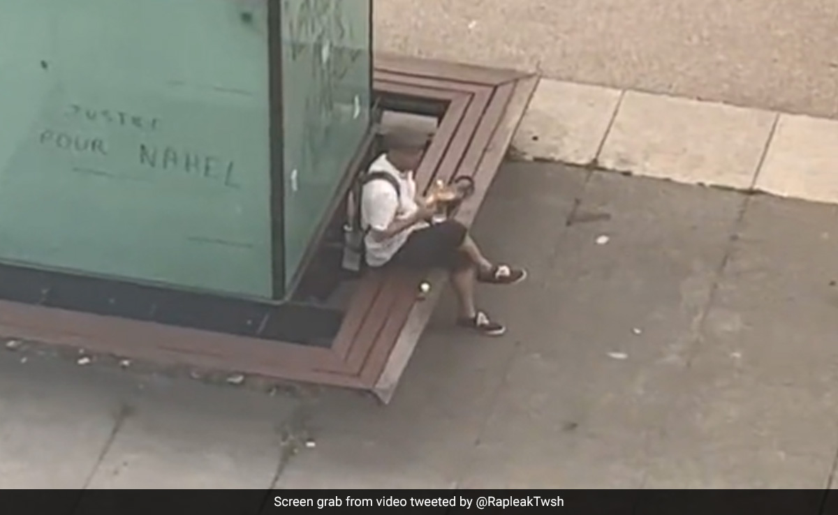 Watch: Man Continues To Eat Sandwich As Rioters Clash With Cops In France