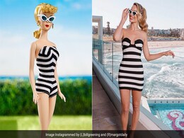In A Black And White Striped Mini Dress, Margot Robbie Was Inspired By The First Barbie Doll Ever Released In 1959 In A Black And White Striped Mini Dress, Margot Robbie Was Inspired By The First Barbie Doll Ever Released In 1959