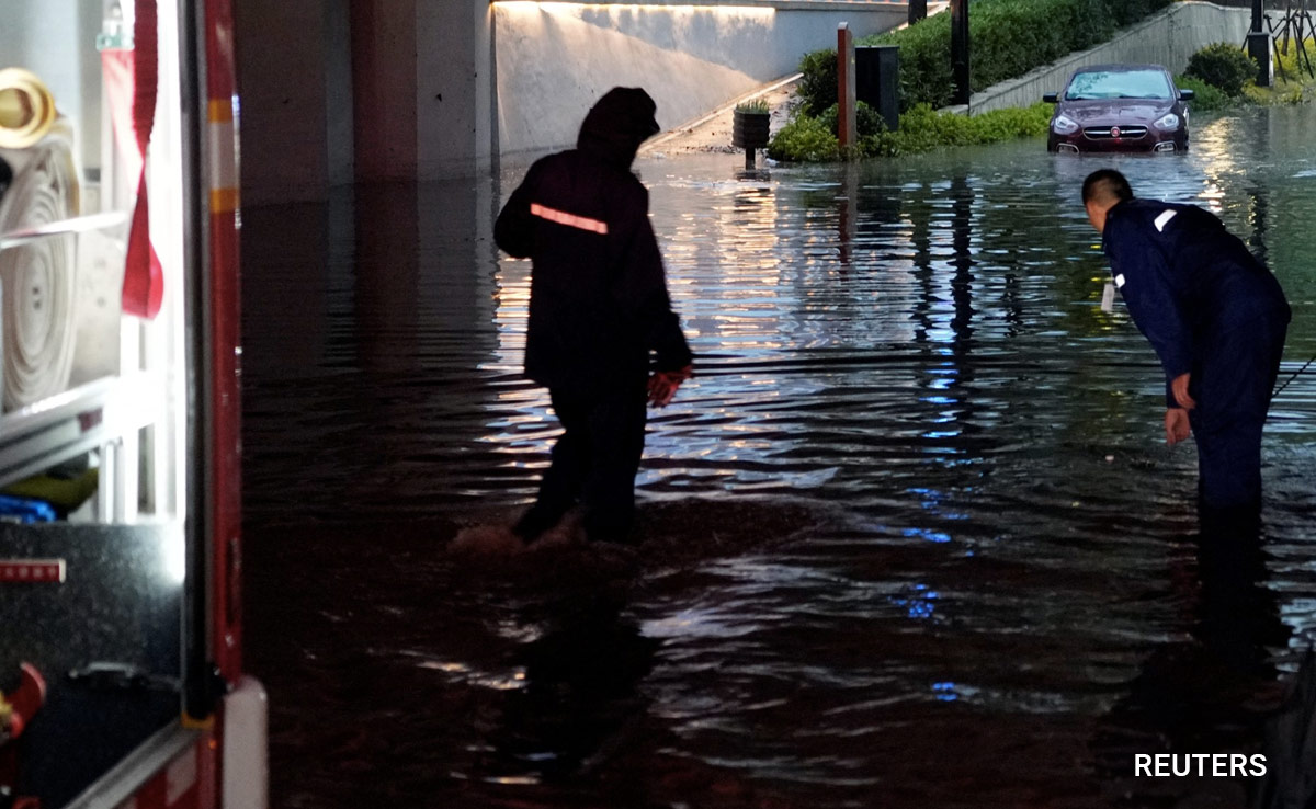 China Cities Brace For Floods As Heat Scorches Inland Regions