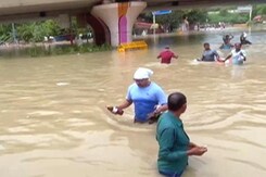 Stranded People Wade Through Waist-Deep Floodwater In Central Delhi Stranded People Wade Through Waist-Deep Floodwater In Central Delhi