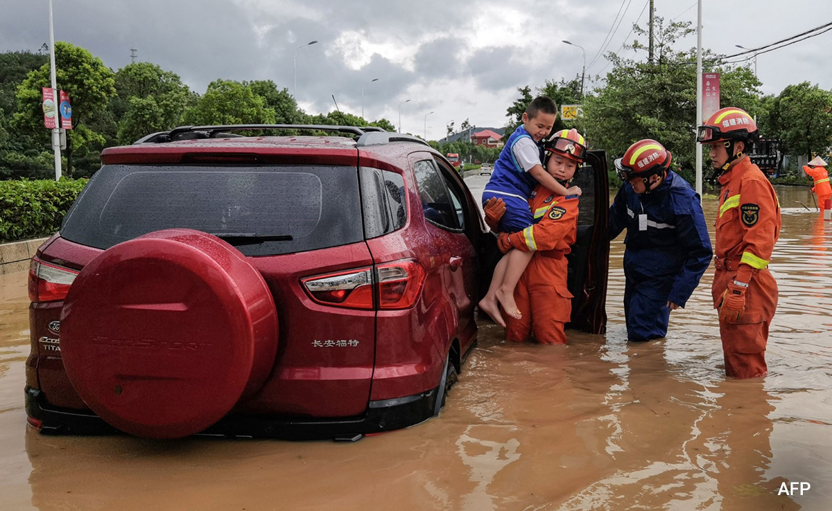 Tens Of Thousands Evacuated As Typhoon Doksuri Batters China