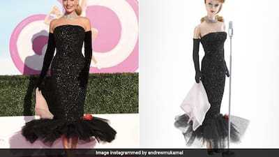 barbie dressed in black Margot Robbie Is A Real Life 60s Glam Doll In A Sparkling Black Strapless  Schiaparelli Dress For Barbie Movie Promotions